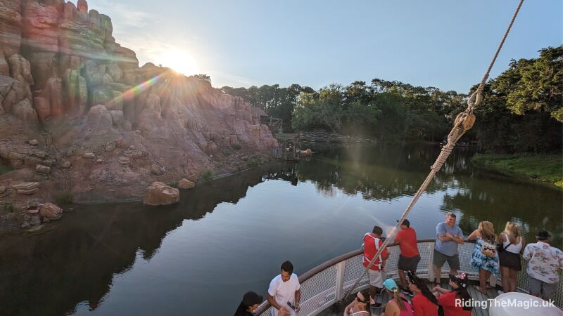The view from the front of the Liberty Bell as the sun sets behind Frontierland rocky landscape