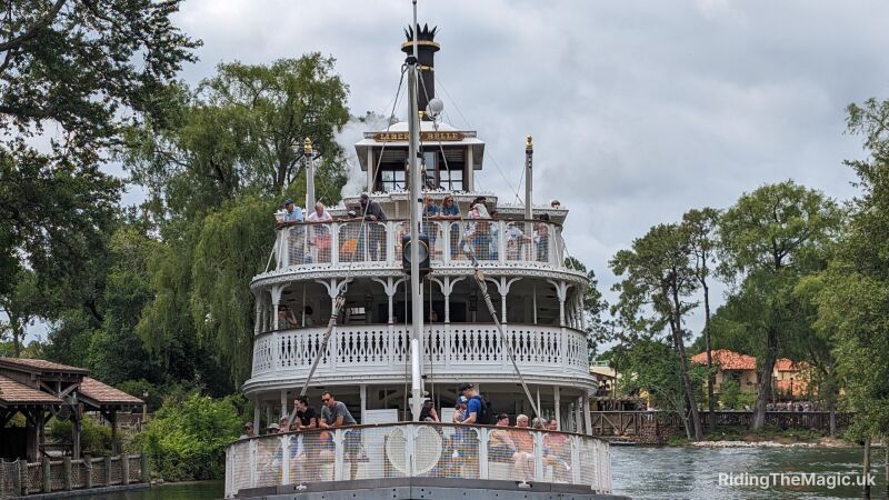 The front of the liberty bell boat as she sails by in Magic Kingdom on a overcast day
