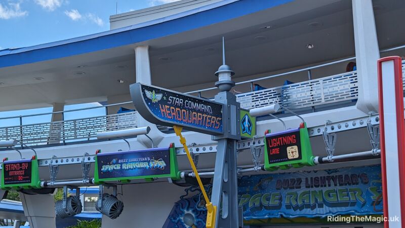 Buzz Lightyear's Space Ranger Spin entrance and Lightning Lane signs at Disney World