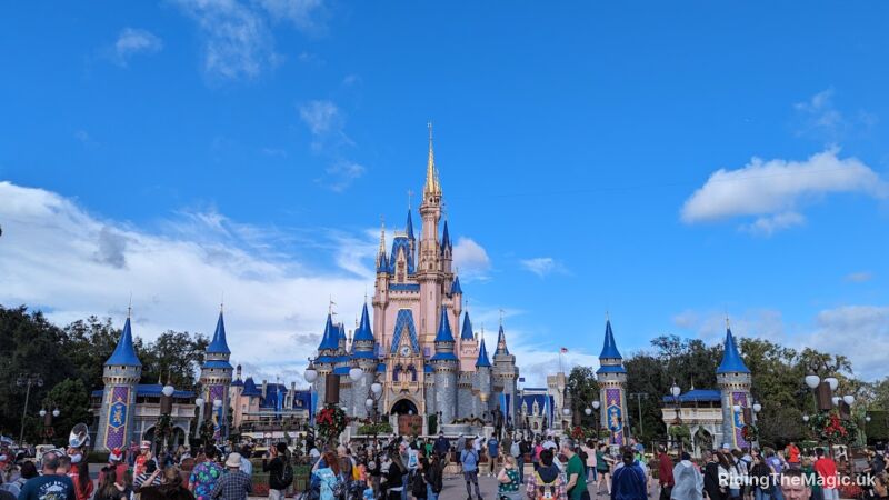 A crowd of people outside of Cinderella's Castle at Walt Disney World