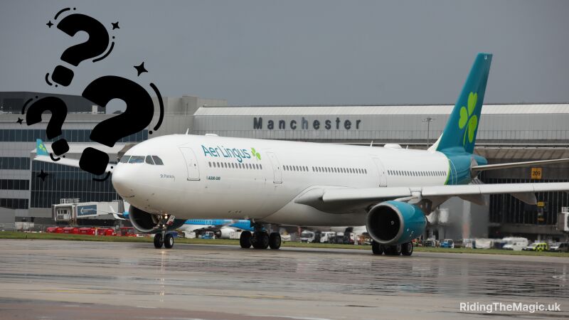 AEI Lingus airplane parked at Manchester airport with a question mark in the foreground