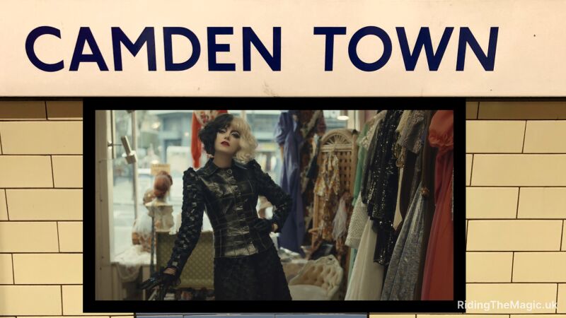 A woman in a black outfit stands in front of a clothing store in Camden Town