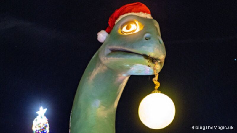 A green dinosaur wearing a Santa hat and holding a glowing ball