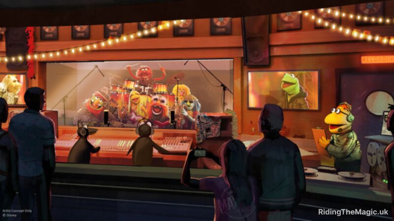 The Muppets are on stage in front of a crowd in a recording studio