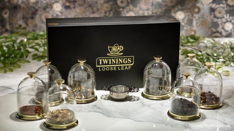 A black box with the words "Twinings Loose Leaf" on it with glass jars