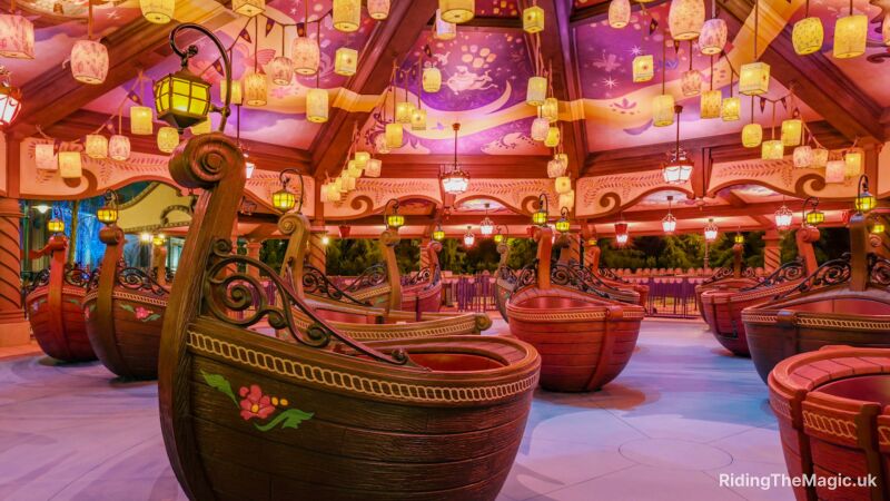 A carousel ride at Disney World featuring boats as seats and a whimsical atmosphere