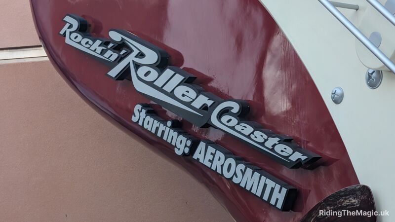 Rockin' Roller Coaster Starring Aerosmith sign on the side of a building