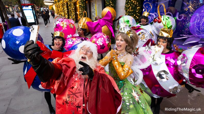 A group of people dressed as Christmas characters are posing for a photo