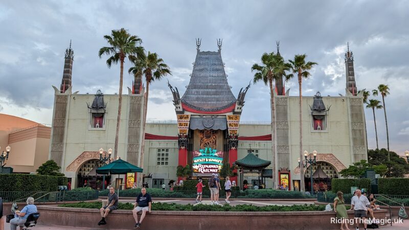 People walk around the entrance of the Mickey and Minnie's Runaway Railway at Disney World
